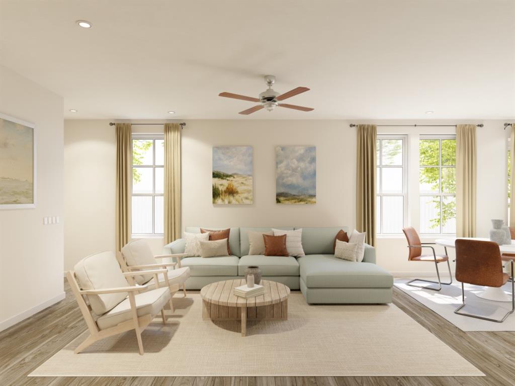 a living room with furniture a table and a large window