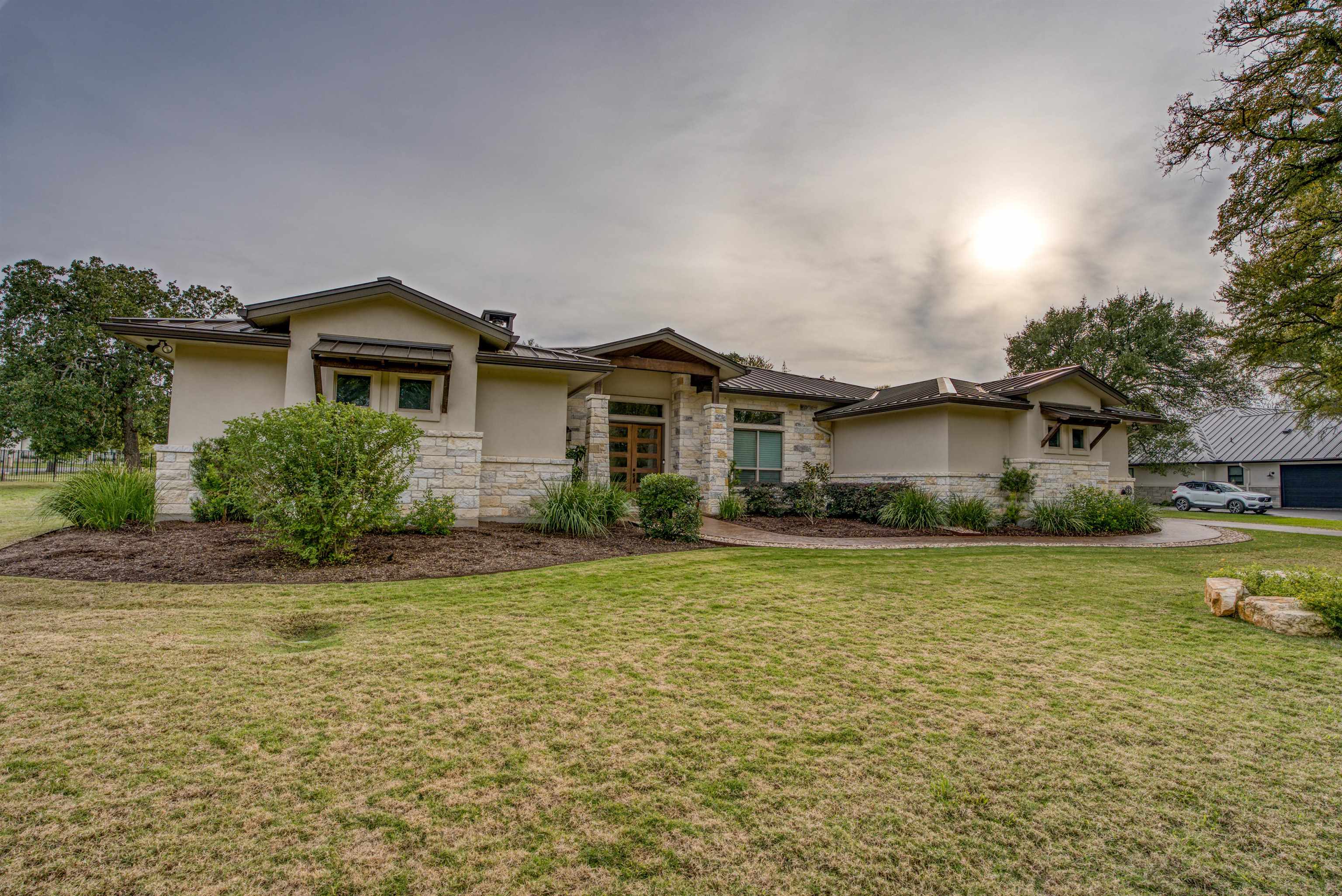 a front view of a house with a yard