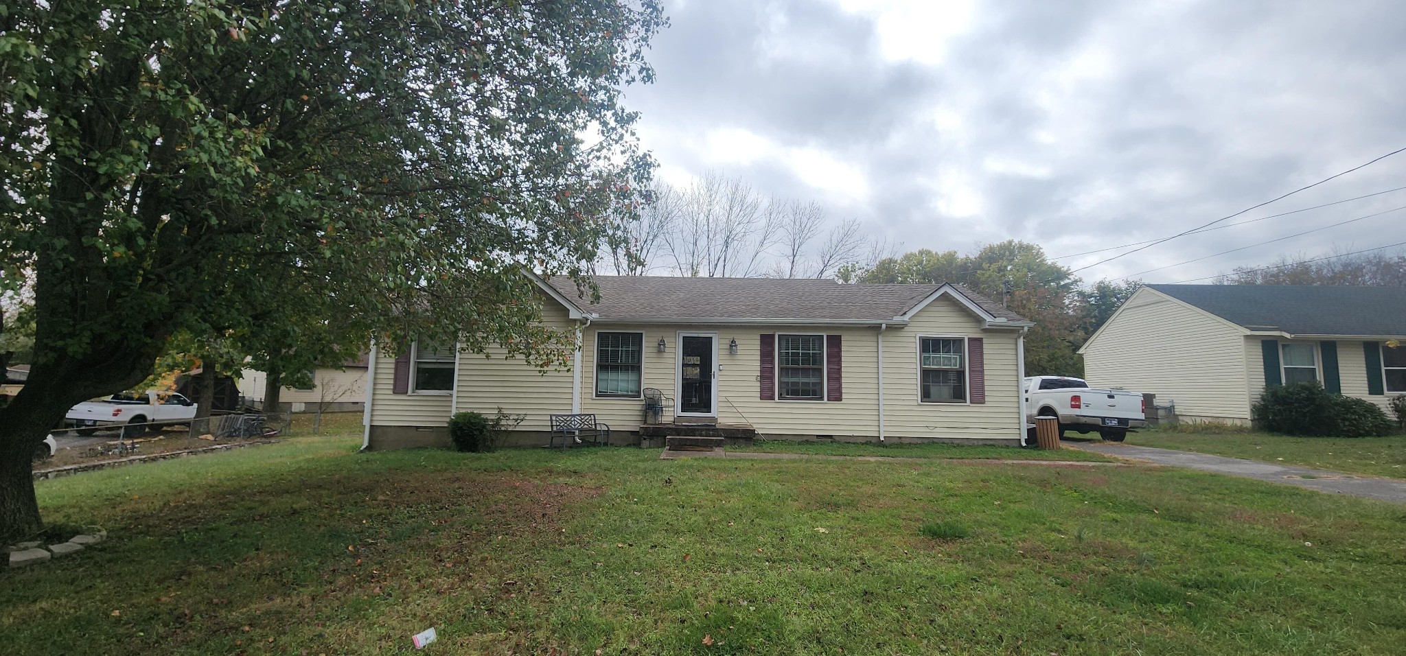 a front view of house with yard and green space