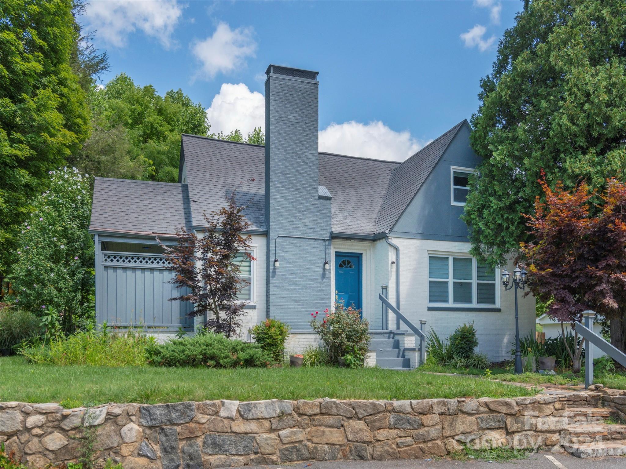 front view of a house with a yard