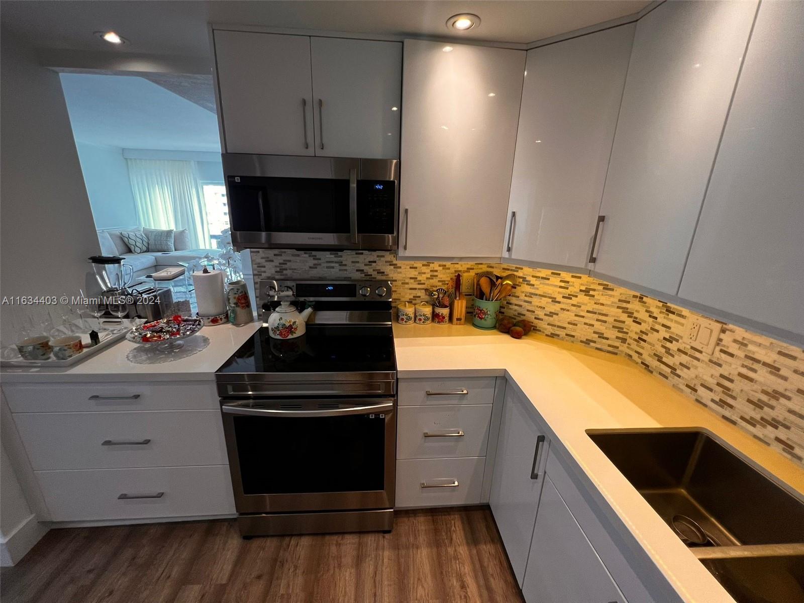 a kitchen with a stove and a sink