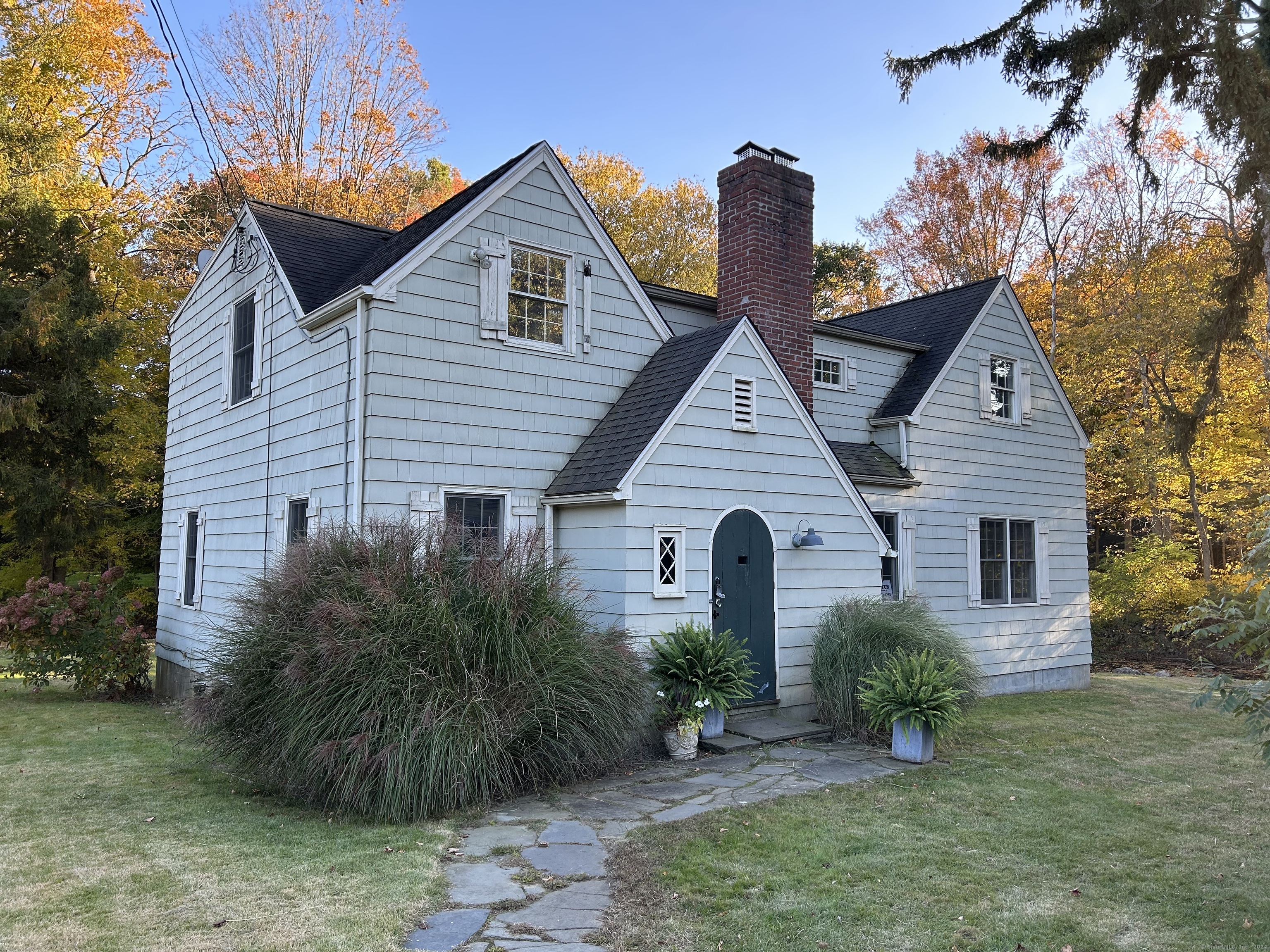 a front view of a house with garden