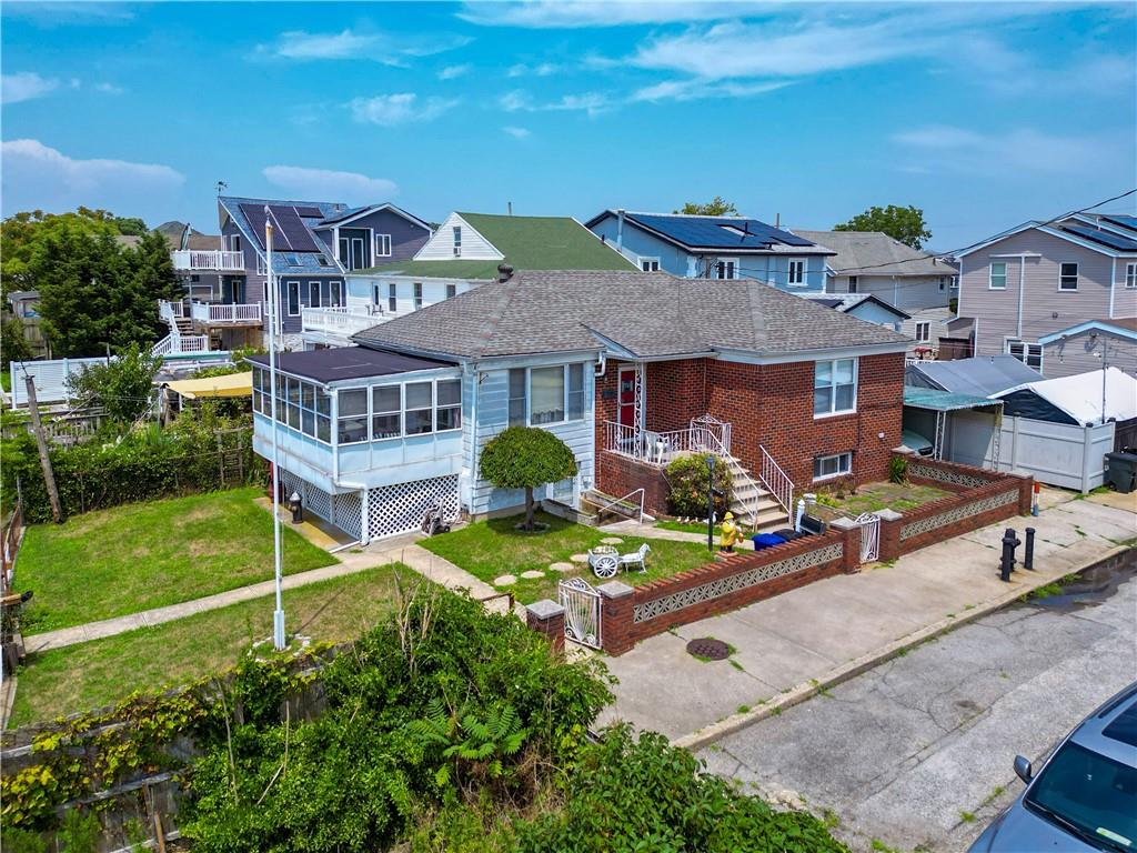 an aerial view of a house with swimming pool garden and patio