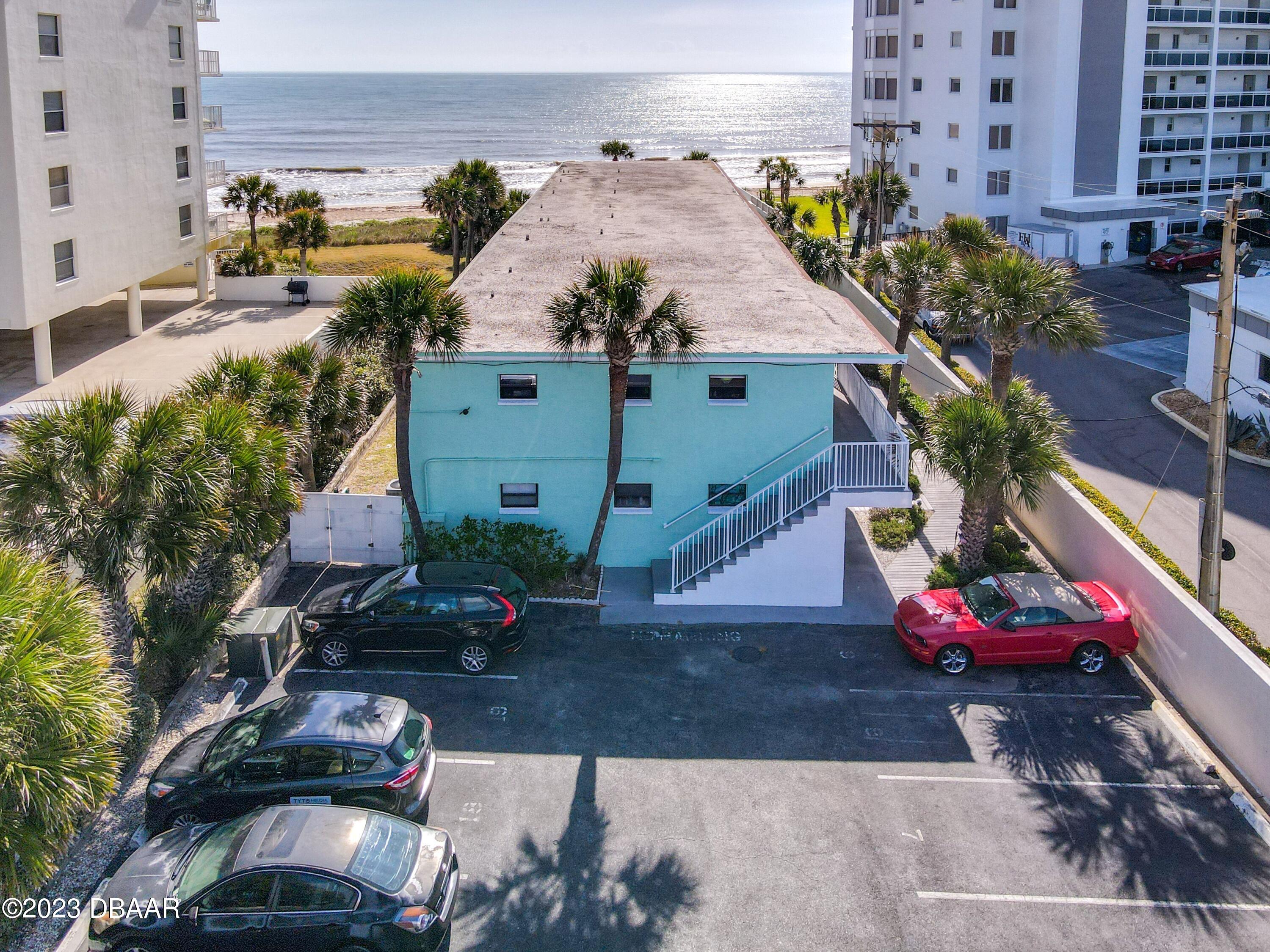 an aerial view of a house with outdoor space