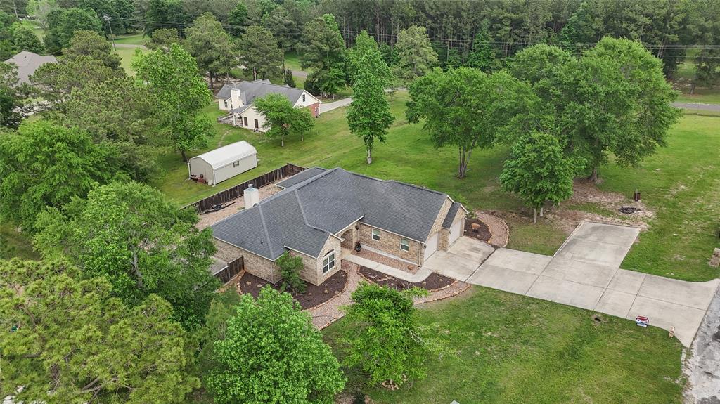 an aerial view of a house with outdoor space