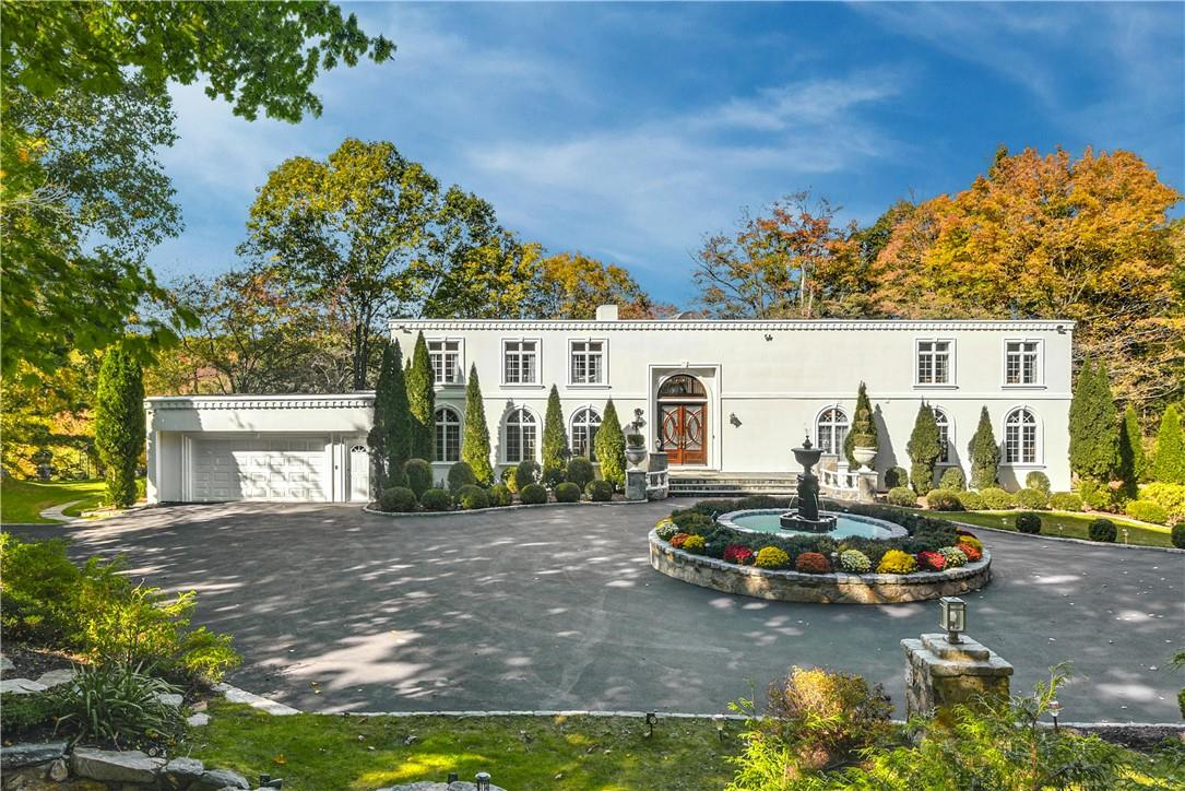 a view of a house with backyard sitting area and swimming pool