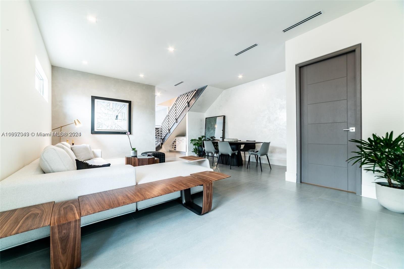 a bedroom with bed and a potted plant