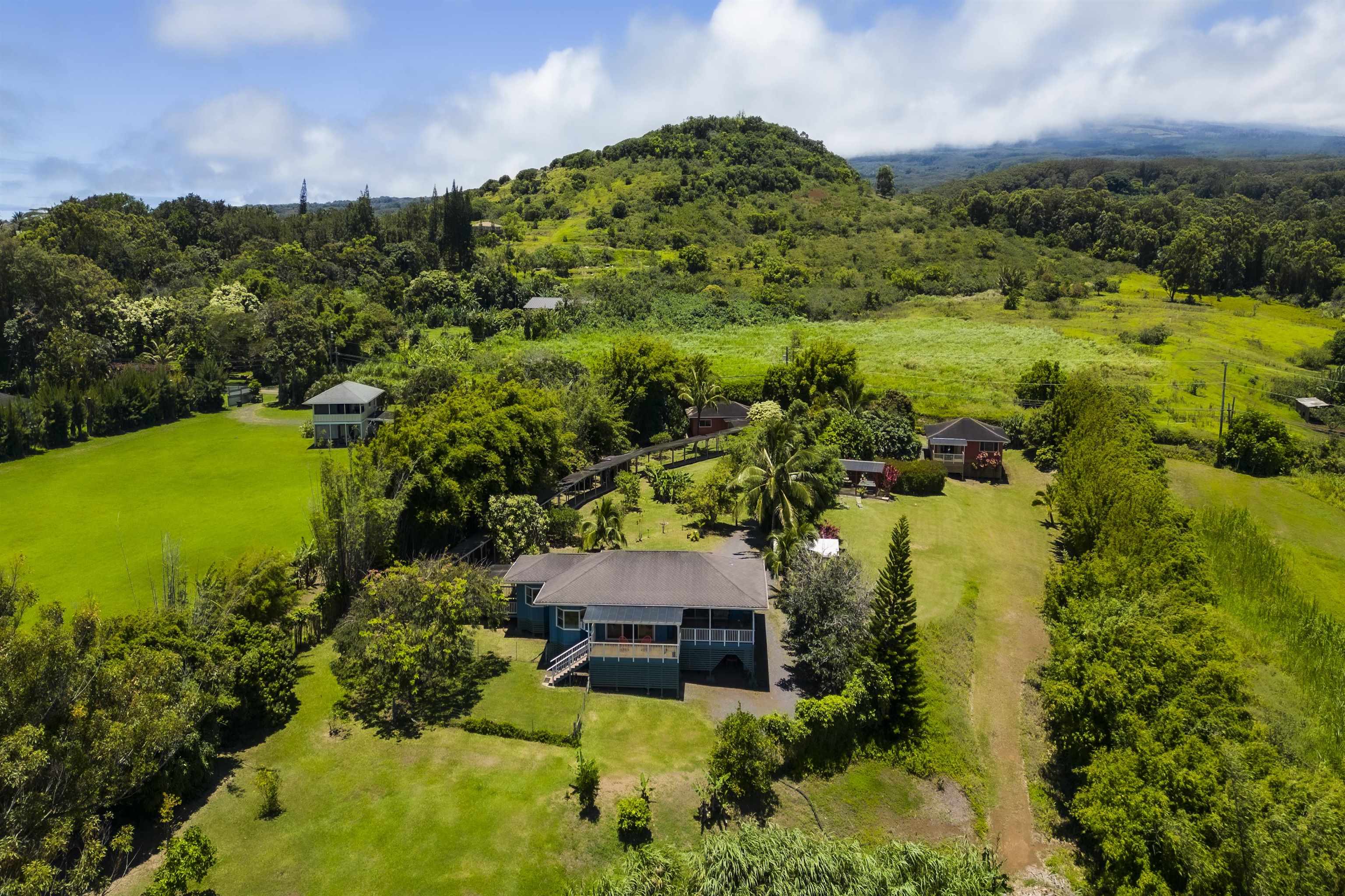 an aerial view of a house with a lake view