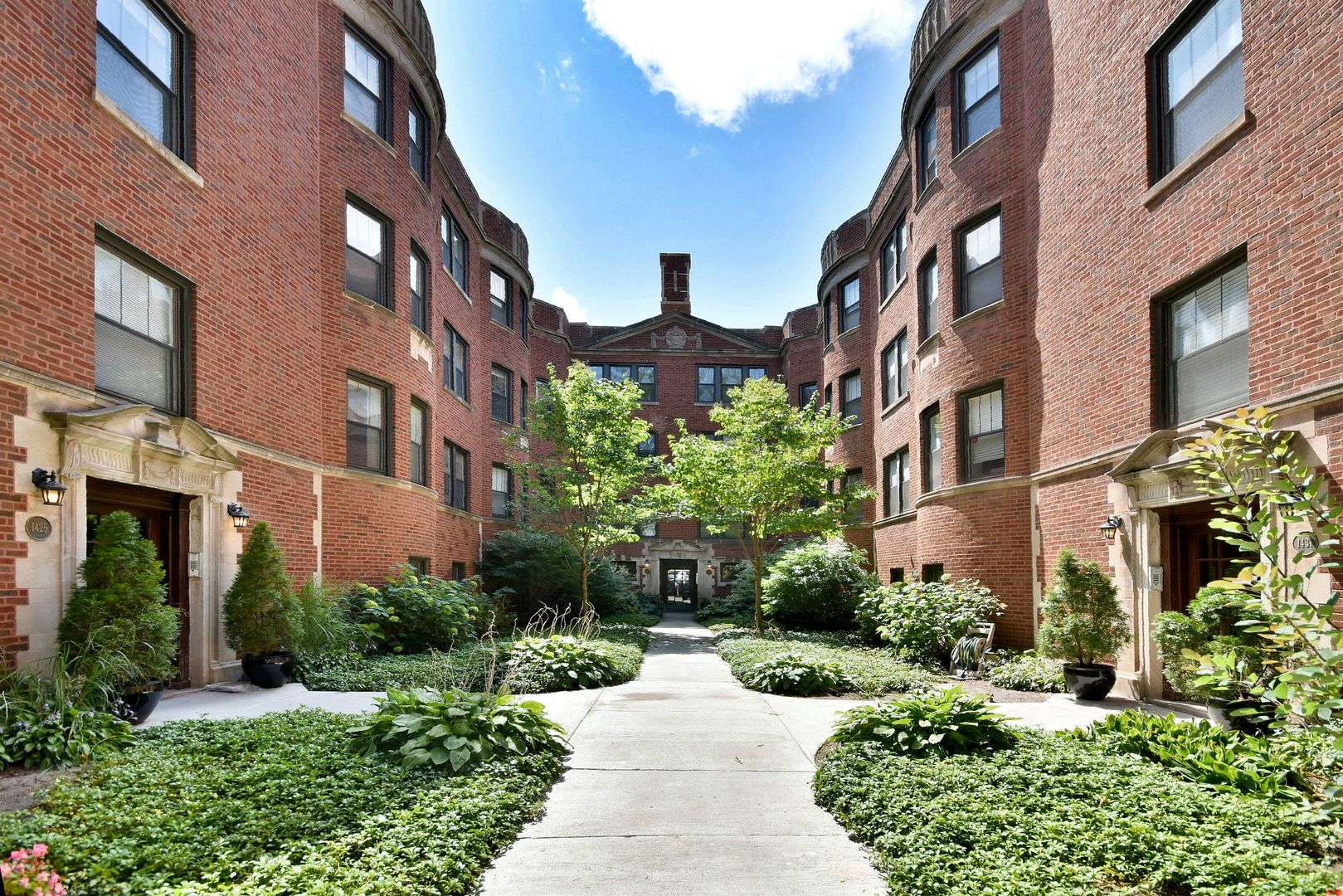 a view of a building with a garden