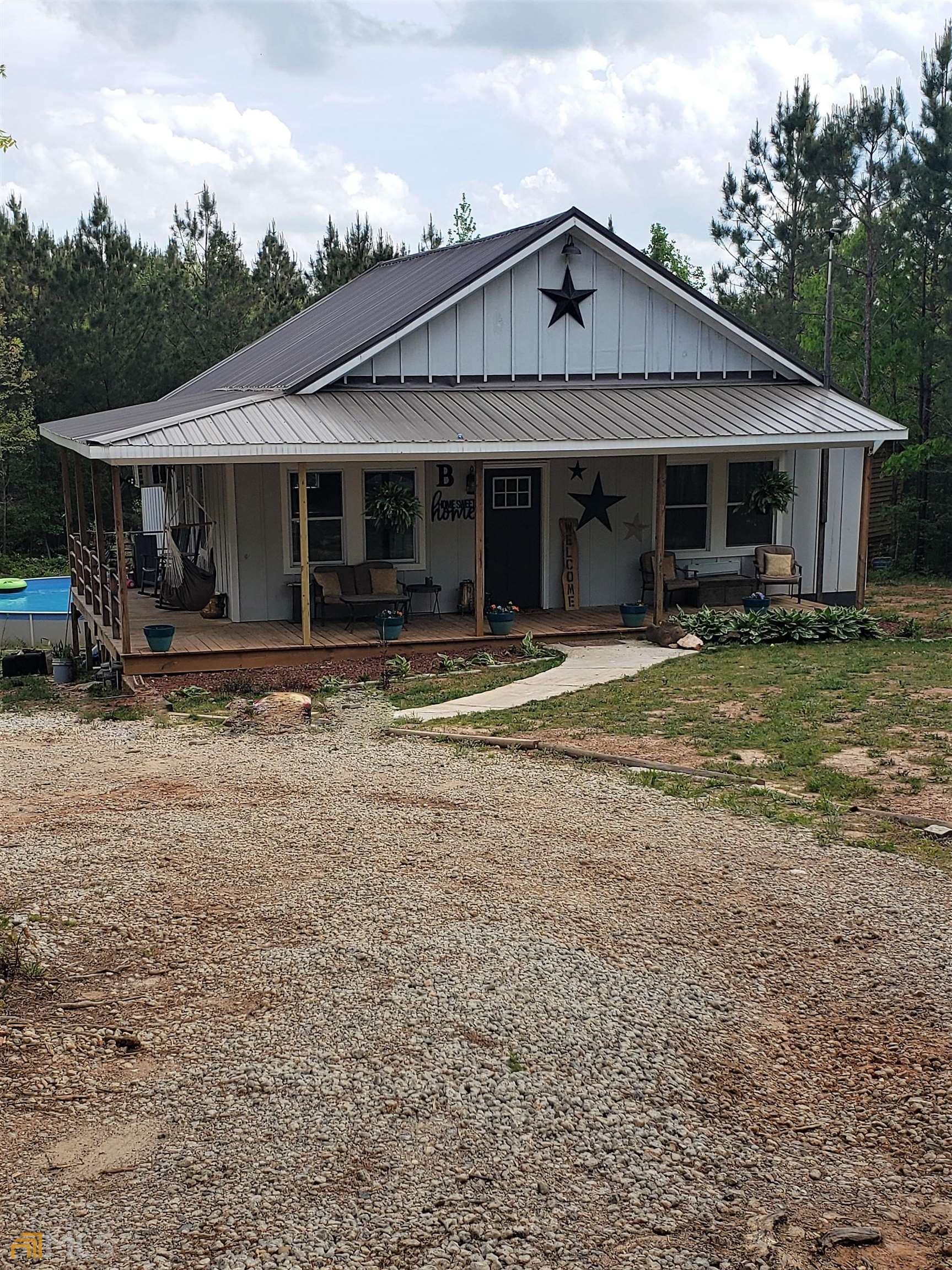 a front view of a house with garden