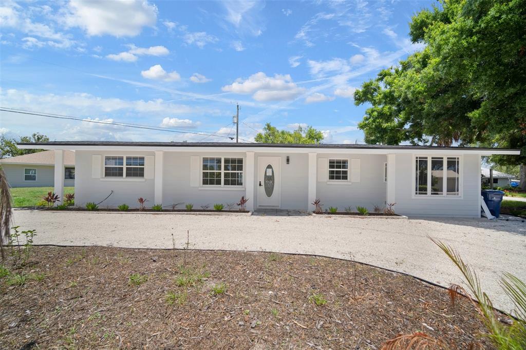 front view of a house with a yard