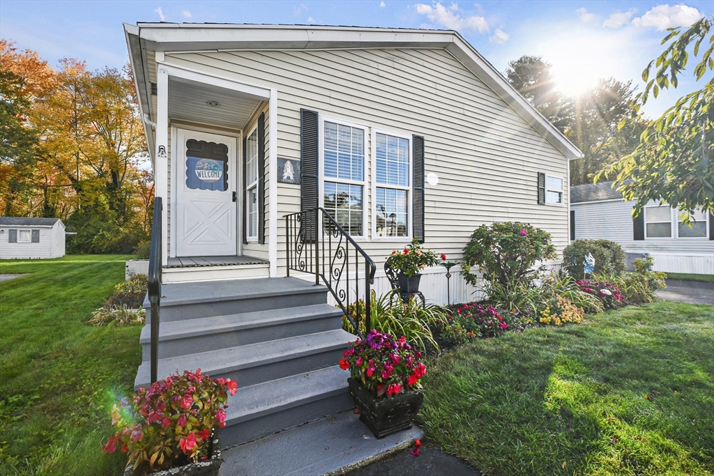 a front view of a house having a yard