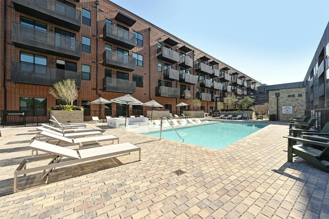 a view of pool with outdoor seating