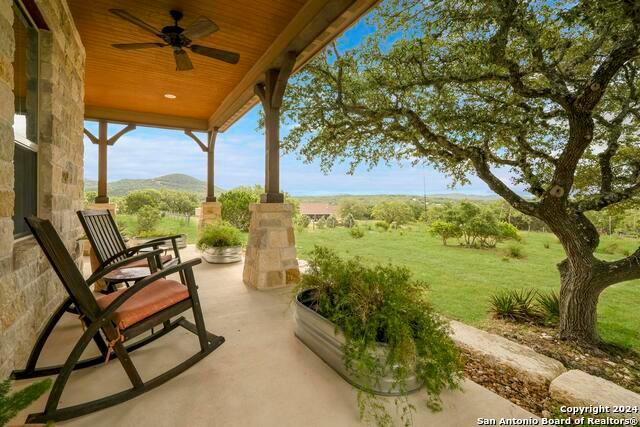 a view of a chairs and table in the patio