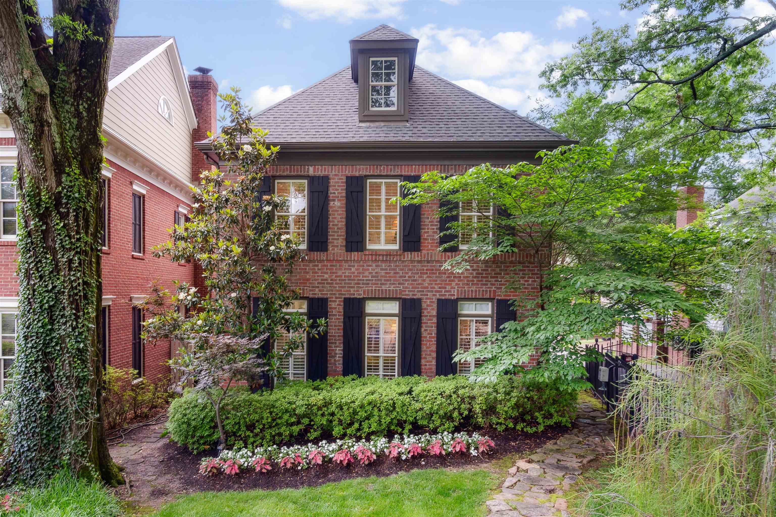 front view of a house with a yard