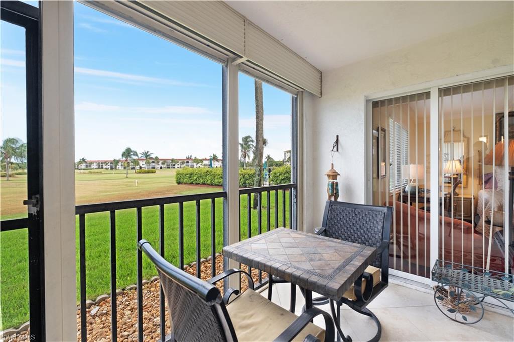 a view of a balcony with chairs