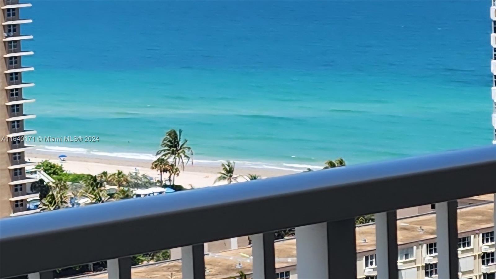 a view of a balcony with an ocean view