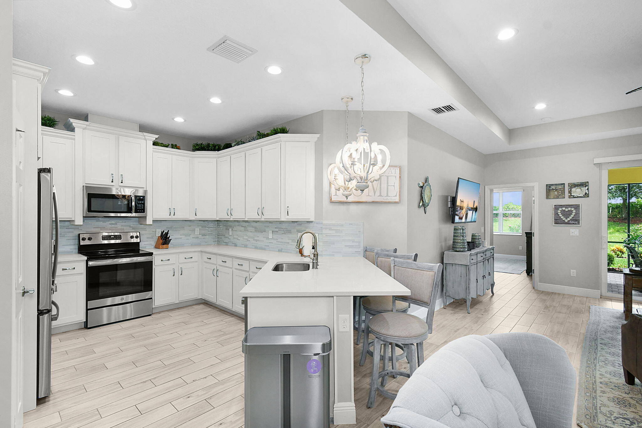 a kitchen with stainless steel appliances kitchen island granite countertop a sink and cabinets