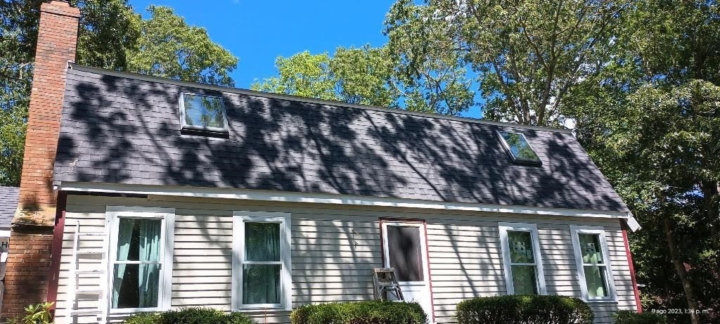 front view of a house with a large window