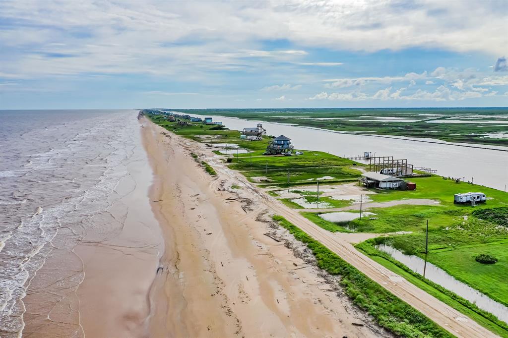 a view of a field with an ocean