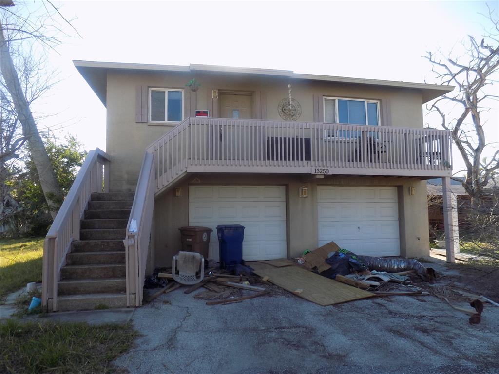 a front view of a house with stairs