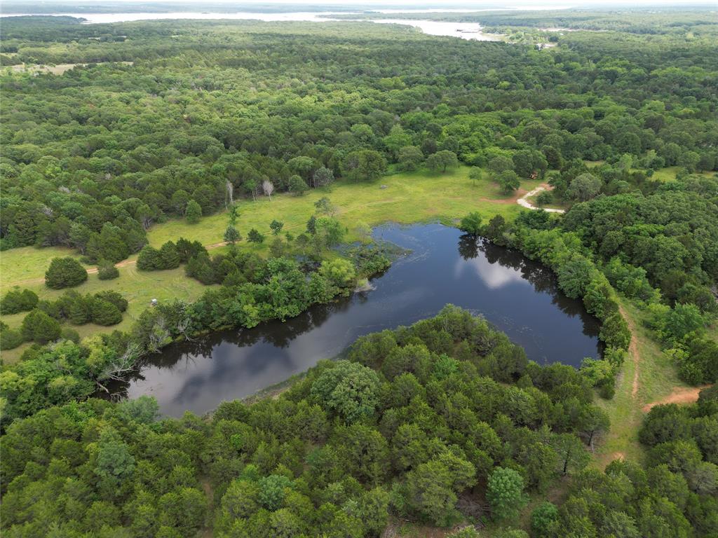 a view of a lake with a yard