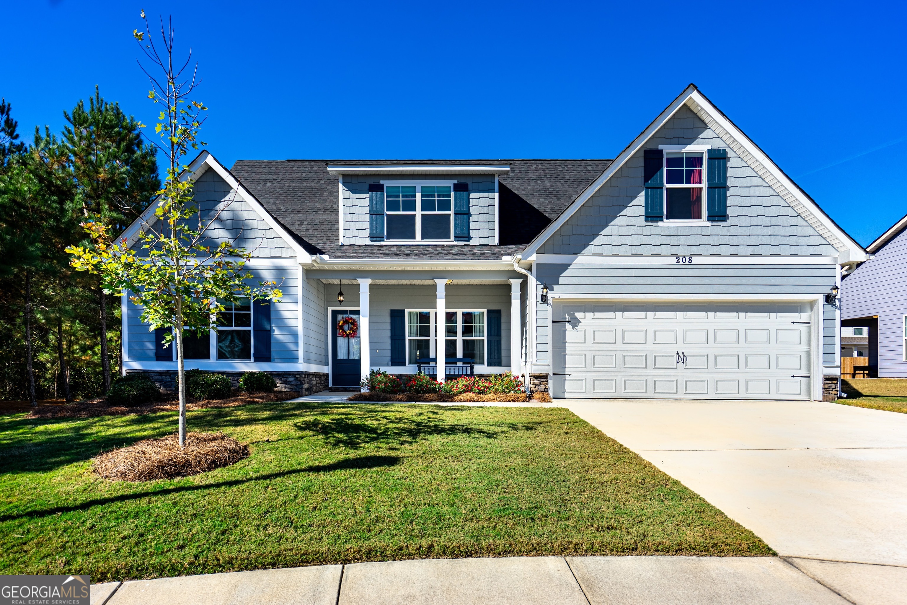 a front view of a house with a yard