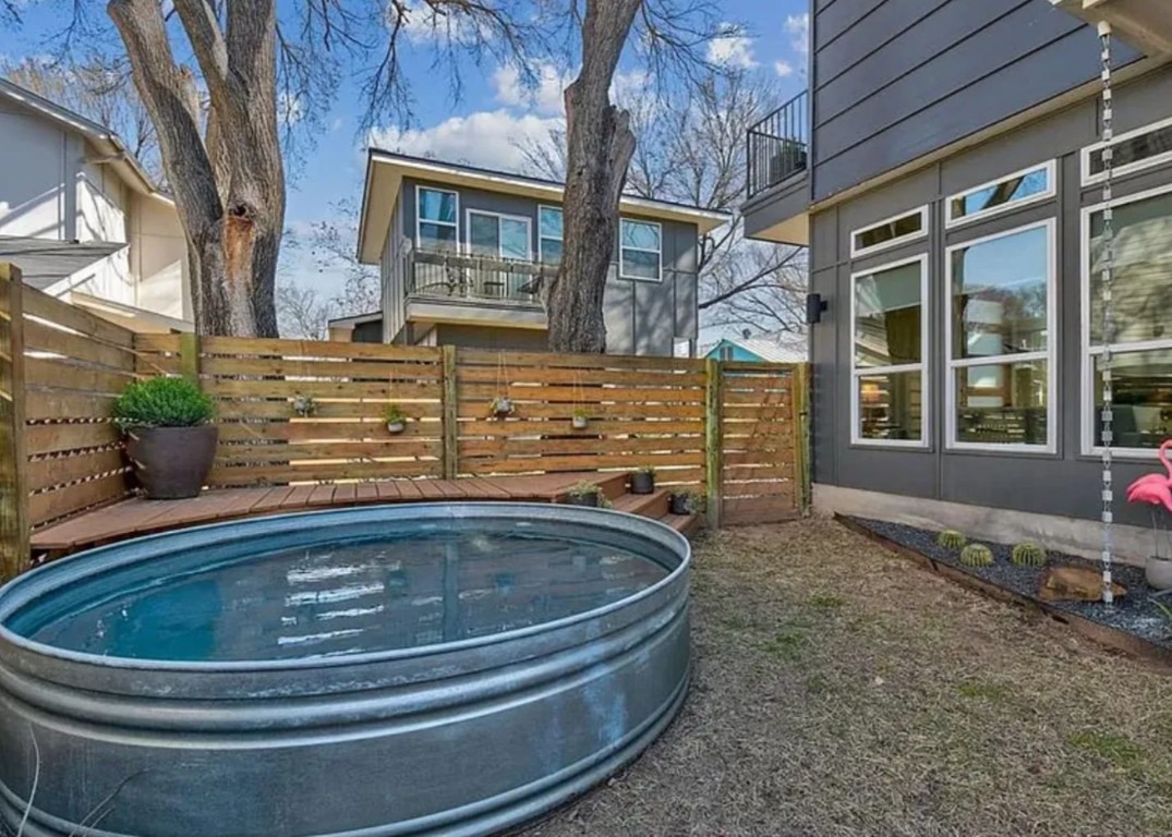 a bath tub sitting in front of a house