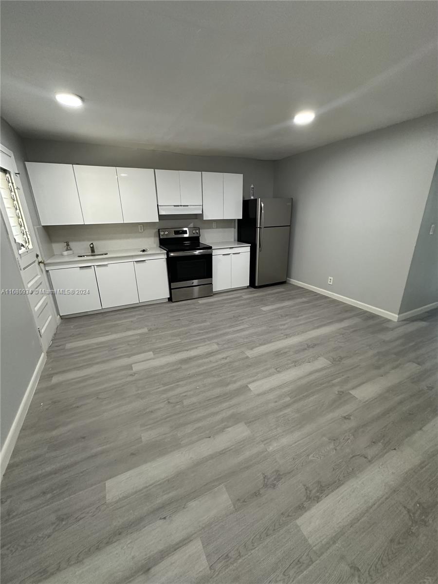 a view of a kitchen with a sink