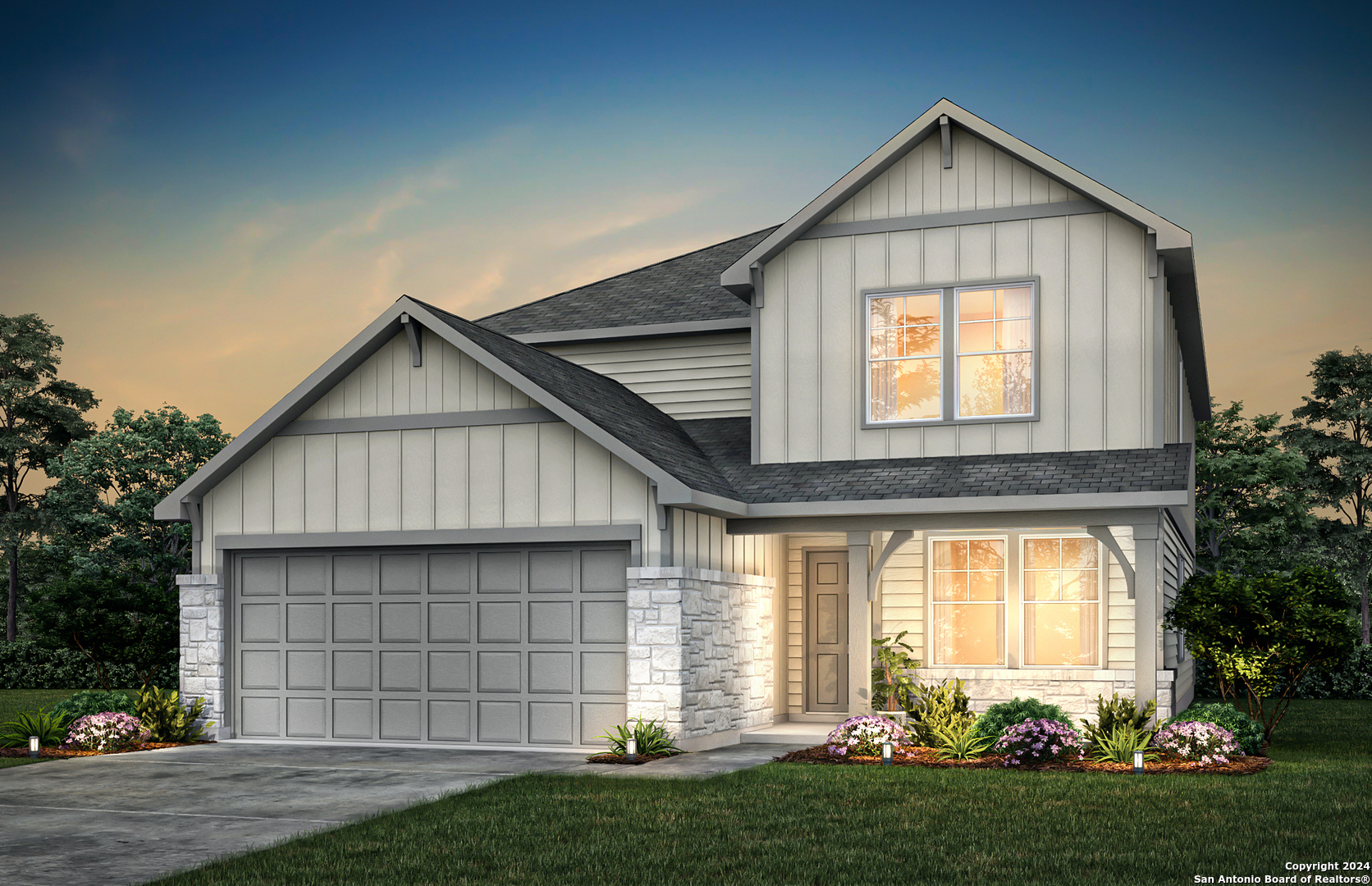 a front view of a house with a yard and garage