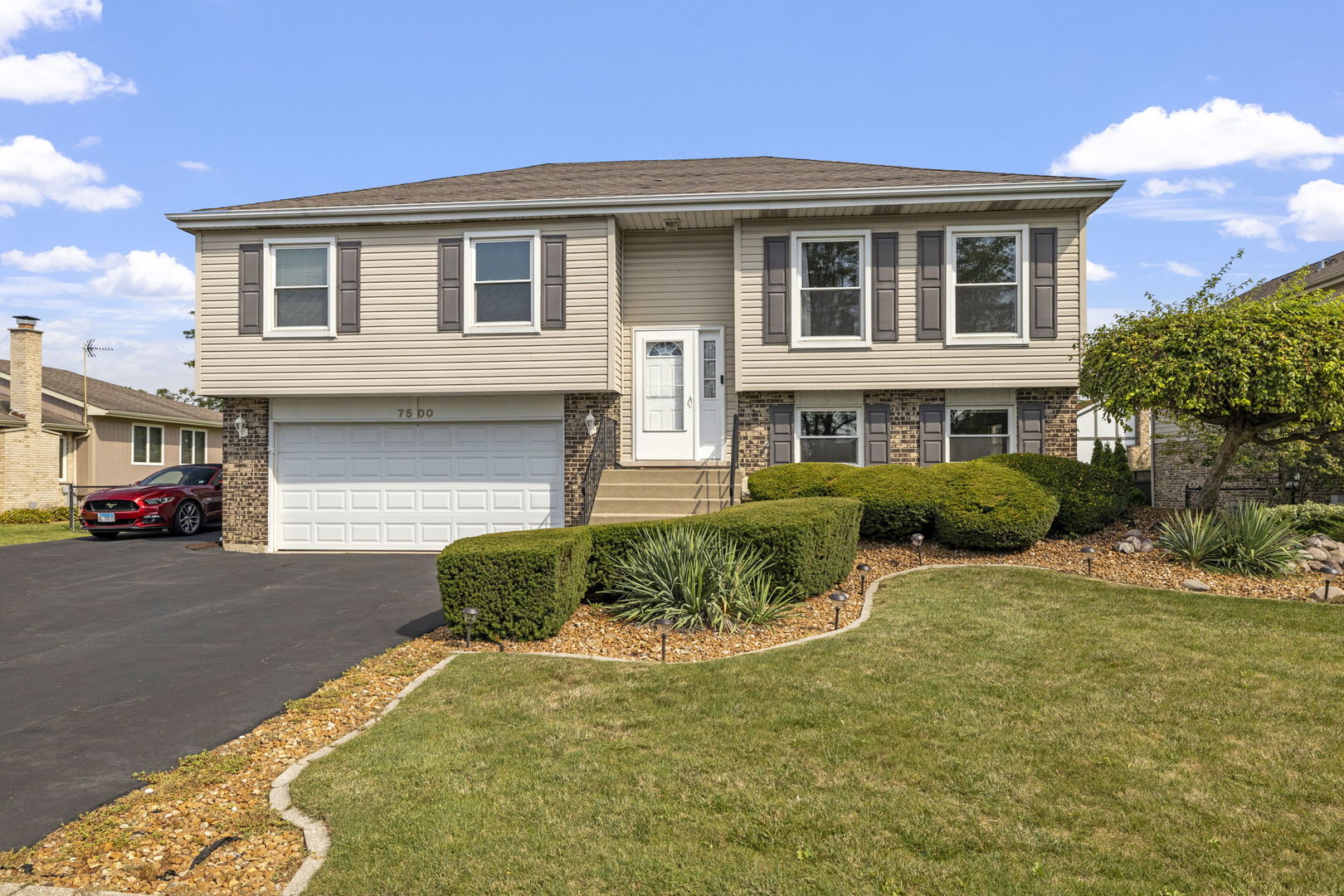 a front view of a house with a yard