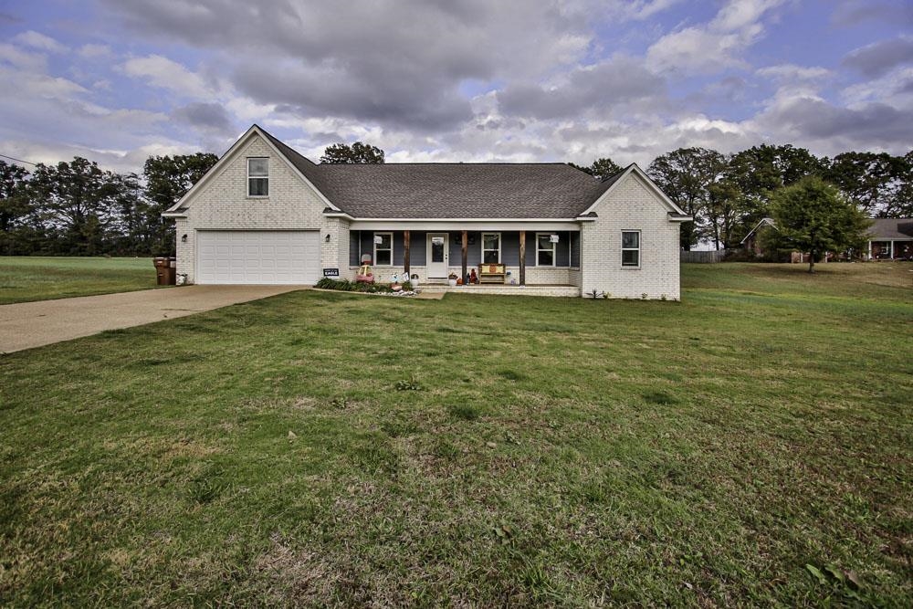 a front view of a house with a yard