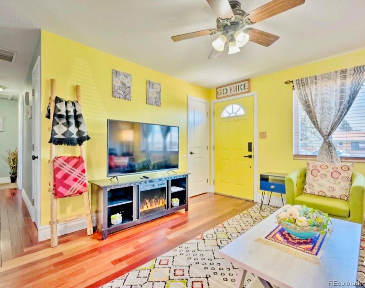 a living room with furniture and a flat screen tv