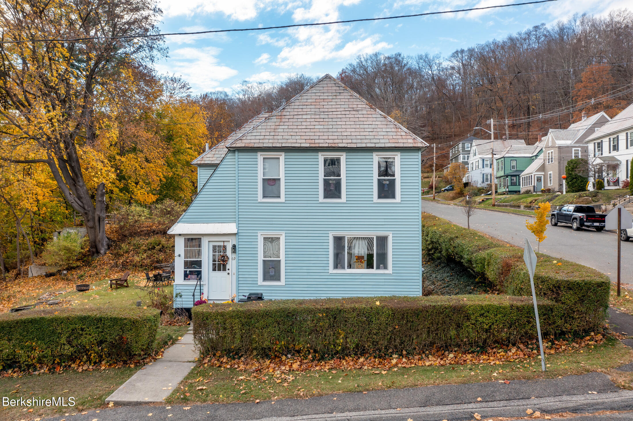 a front view of a house with a yard