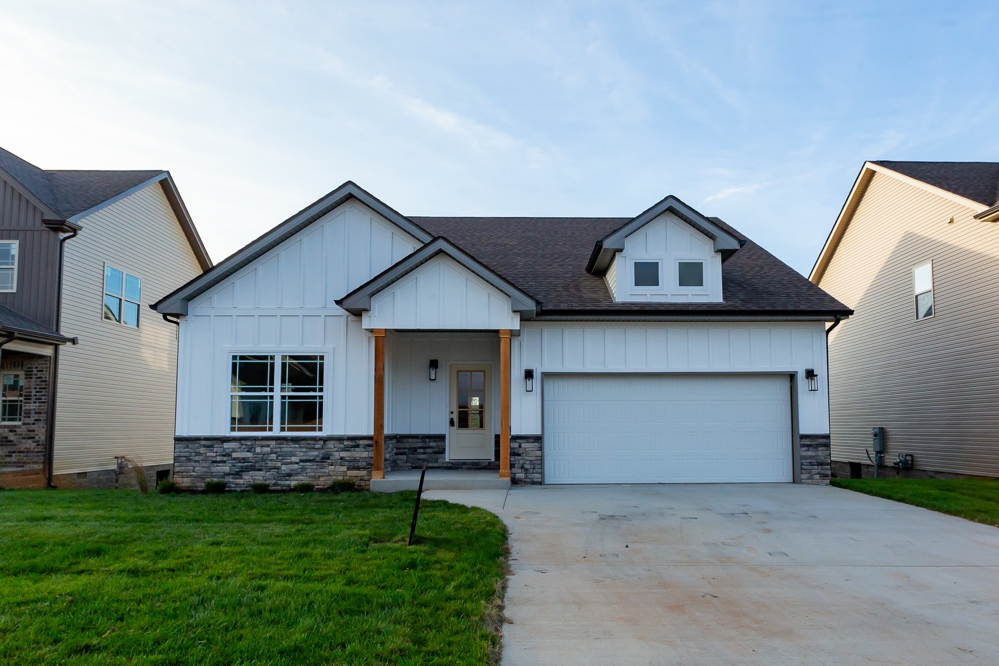 . Looks are deceiving. There are 2 beds down 2 full baths down. Upstairs 2 bedrooms a full bath and a bonus room. The front is made of Hardi board. There is a storage room in the crawl space for storage or storm room.