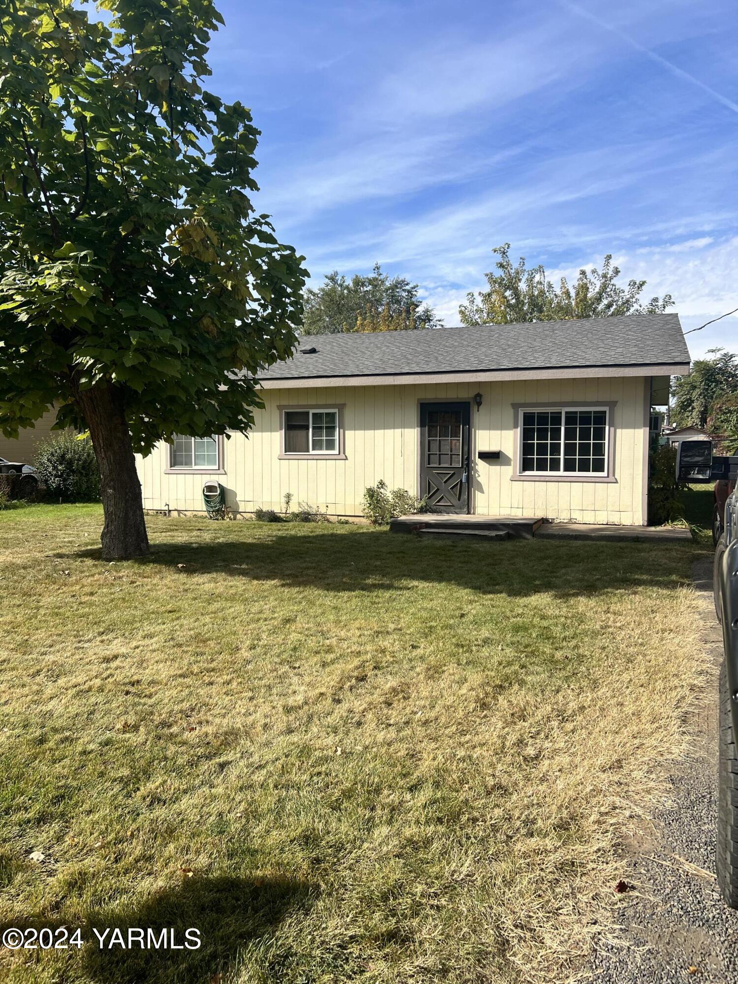 a front view of a house with yard