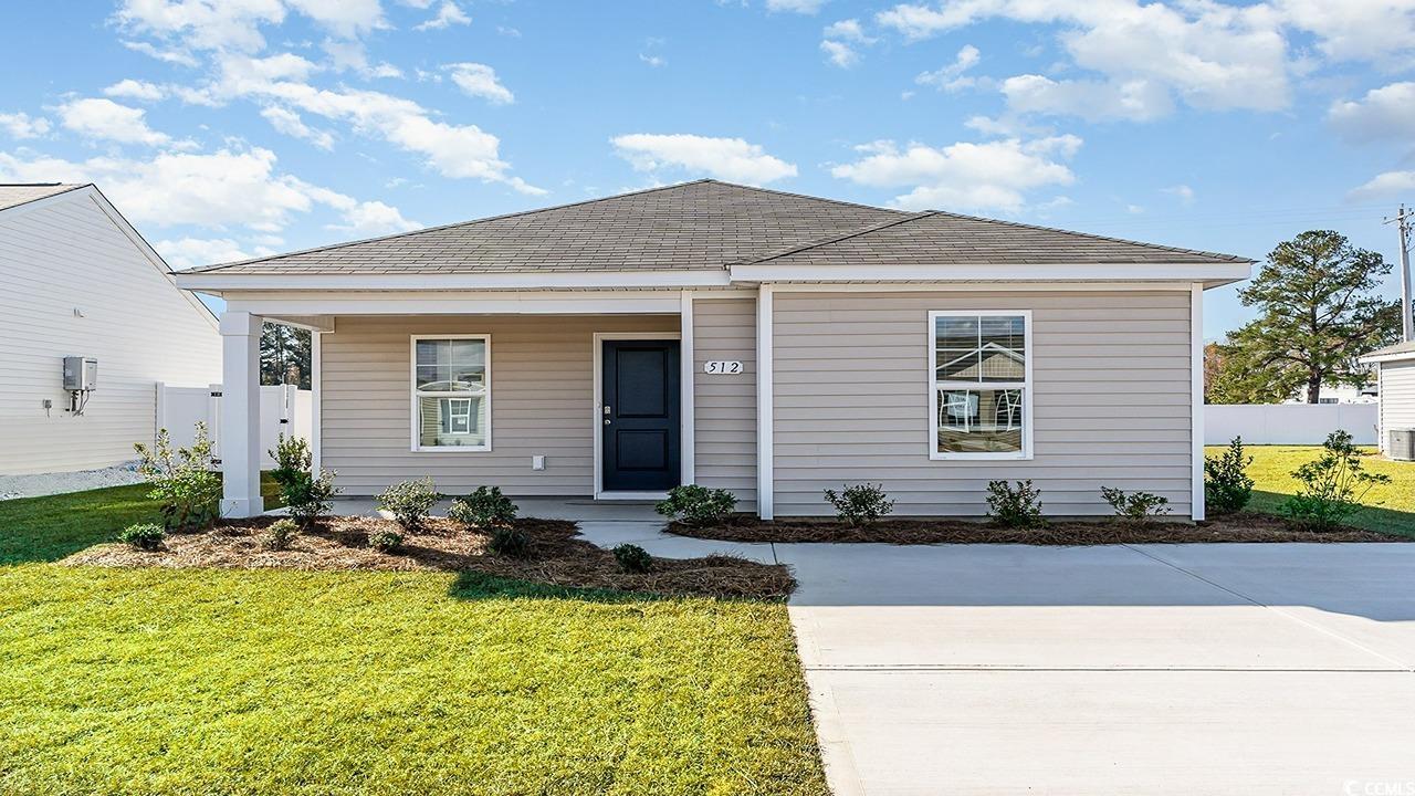 View of front of property with a front yard