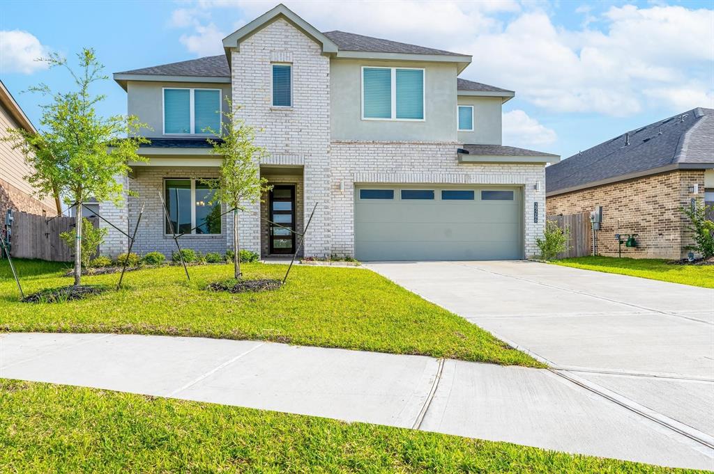 a view of a house with a swimming pool and a yard