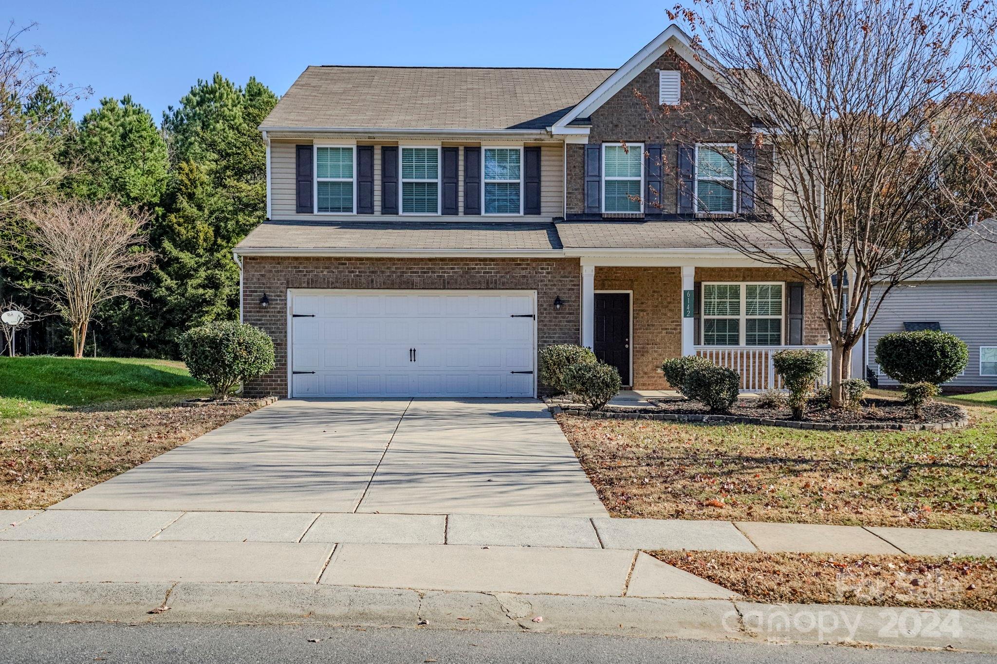 a front view of a house with yard