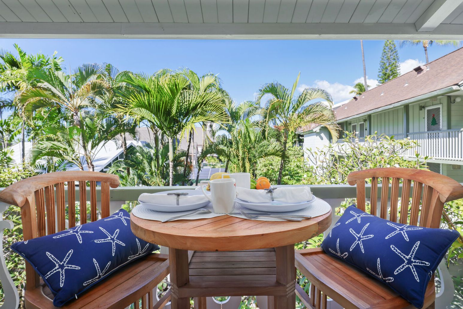 a view of a chairs and table in the patio