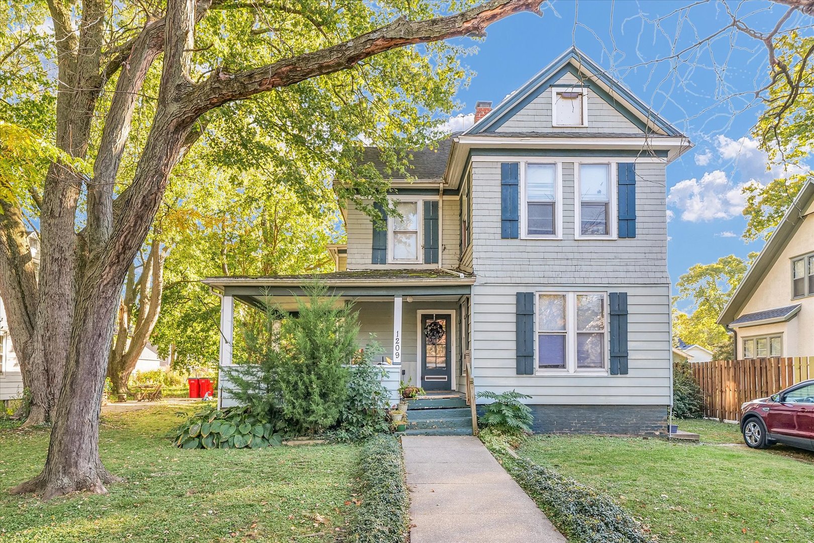 front view of a house with a yard