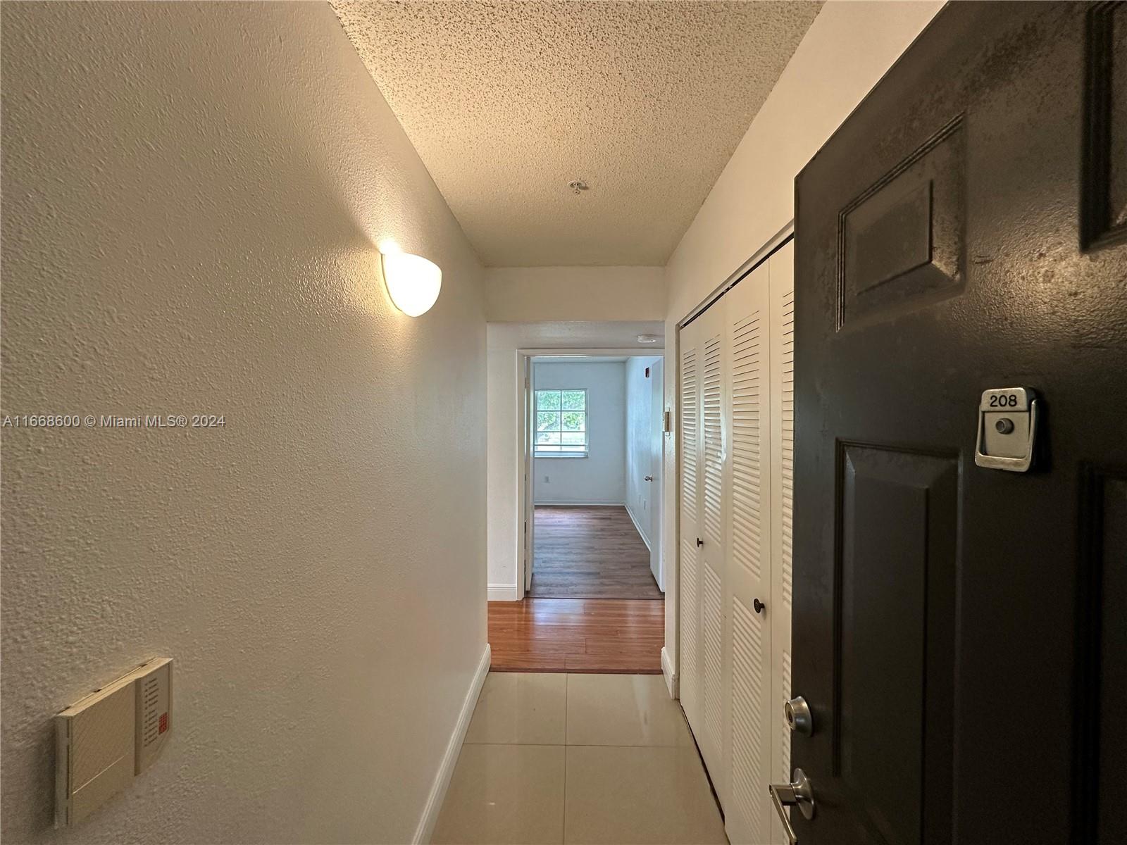 a view of hallway with livingroom