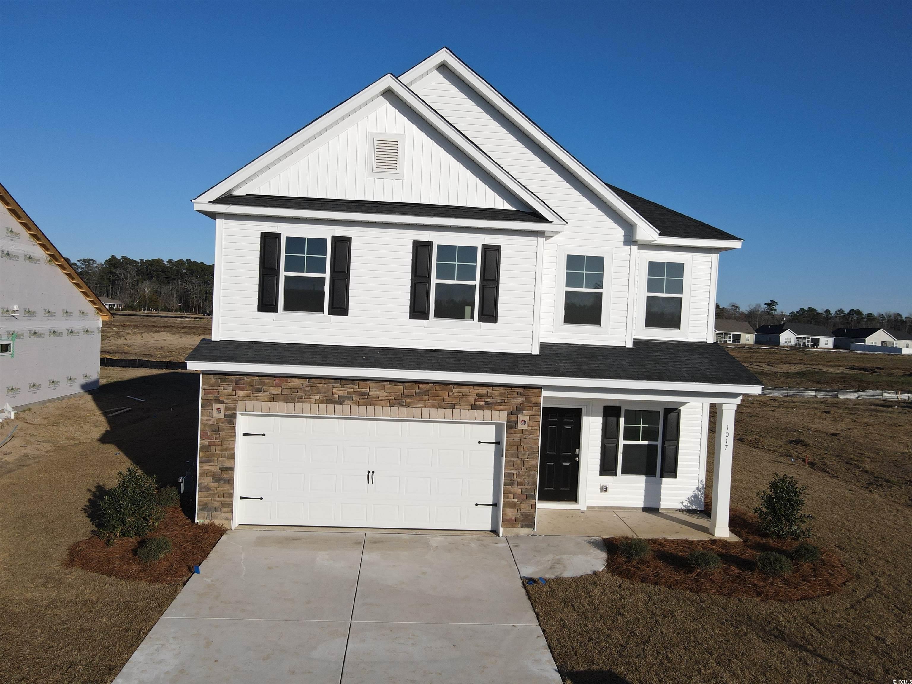 View of front of house with a garage