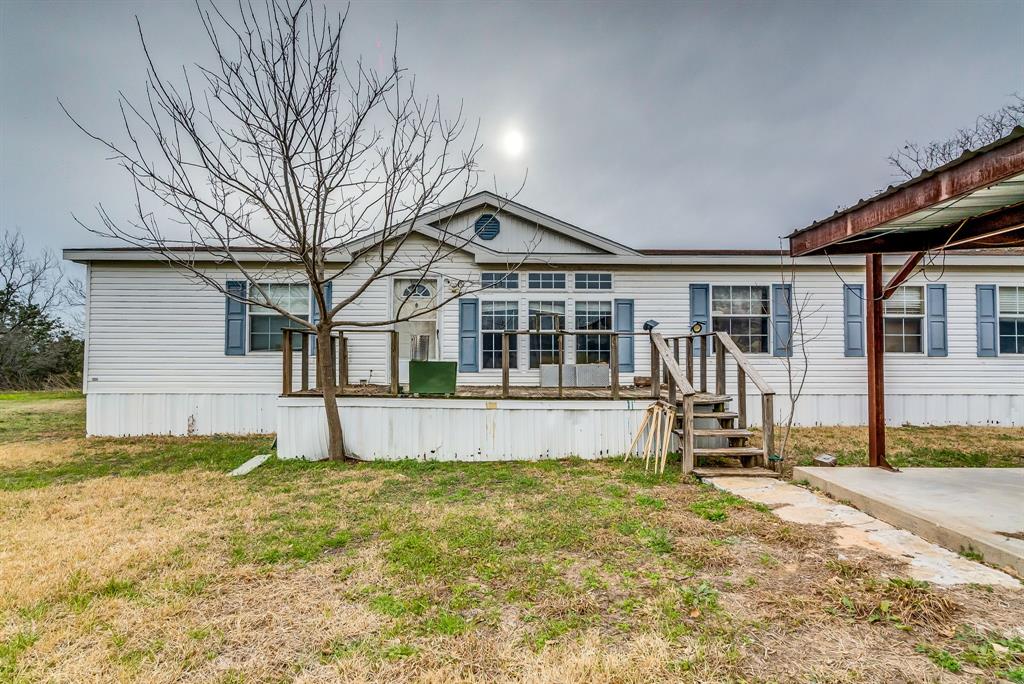 a house view with a backyard space