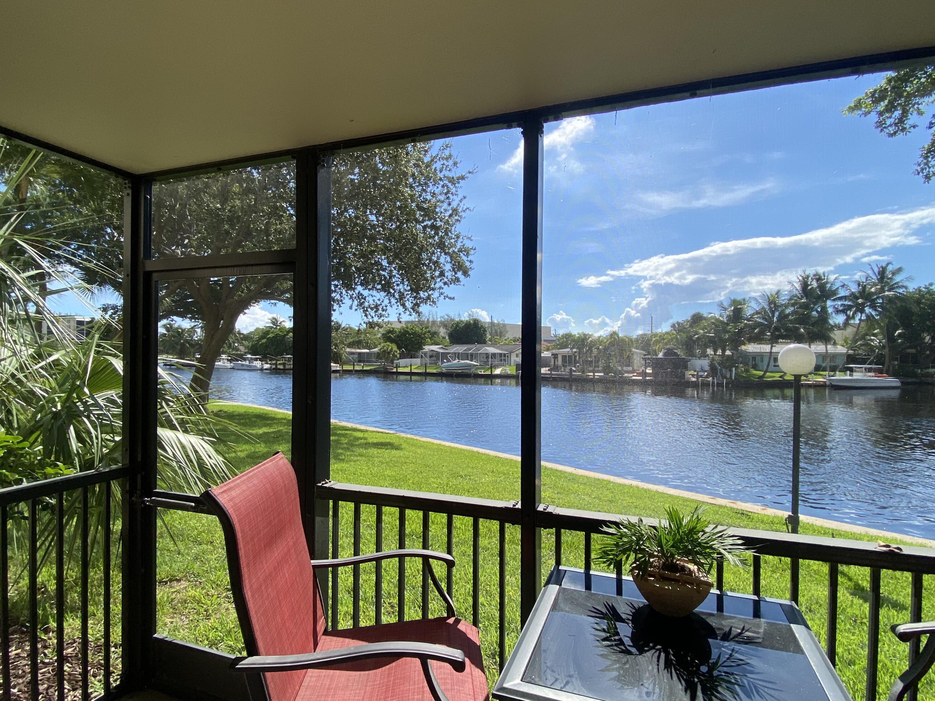 a view of a two chairs in the balcony