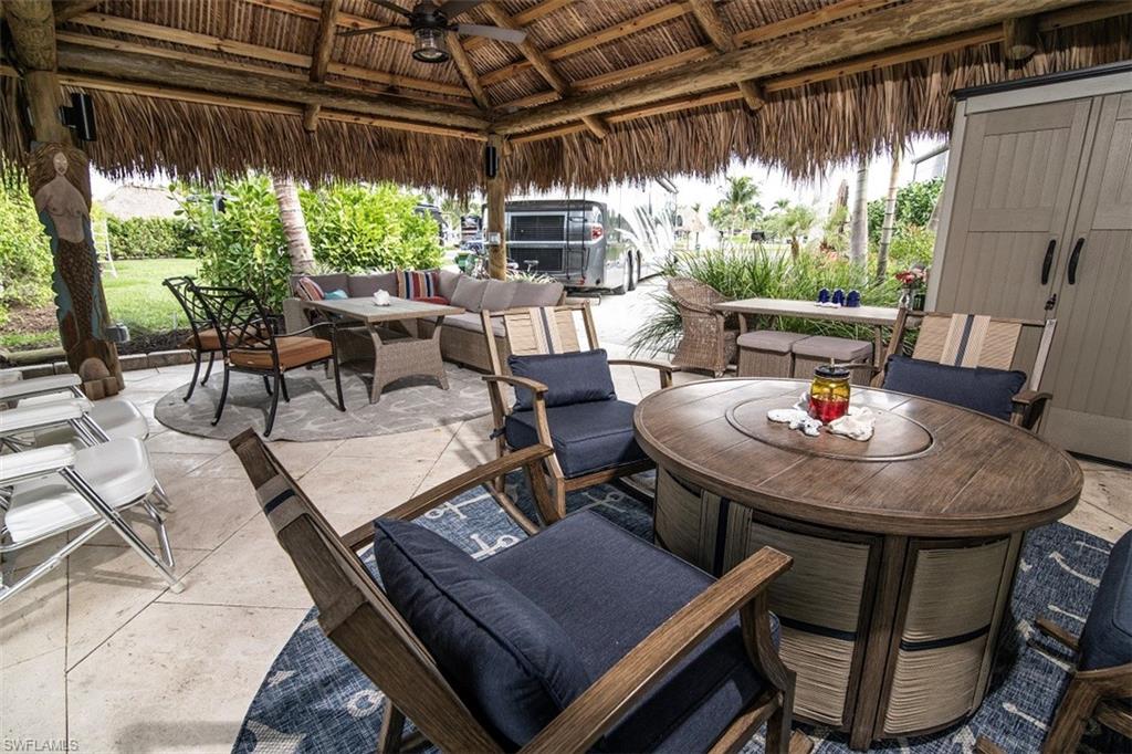 a outdoor dining space with furniture and outdoor view