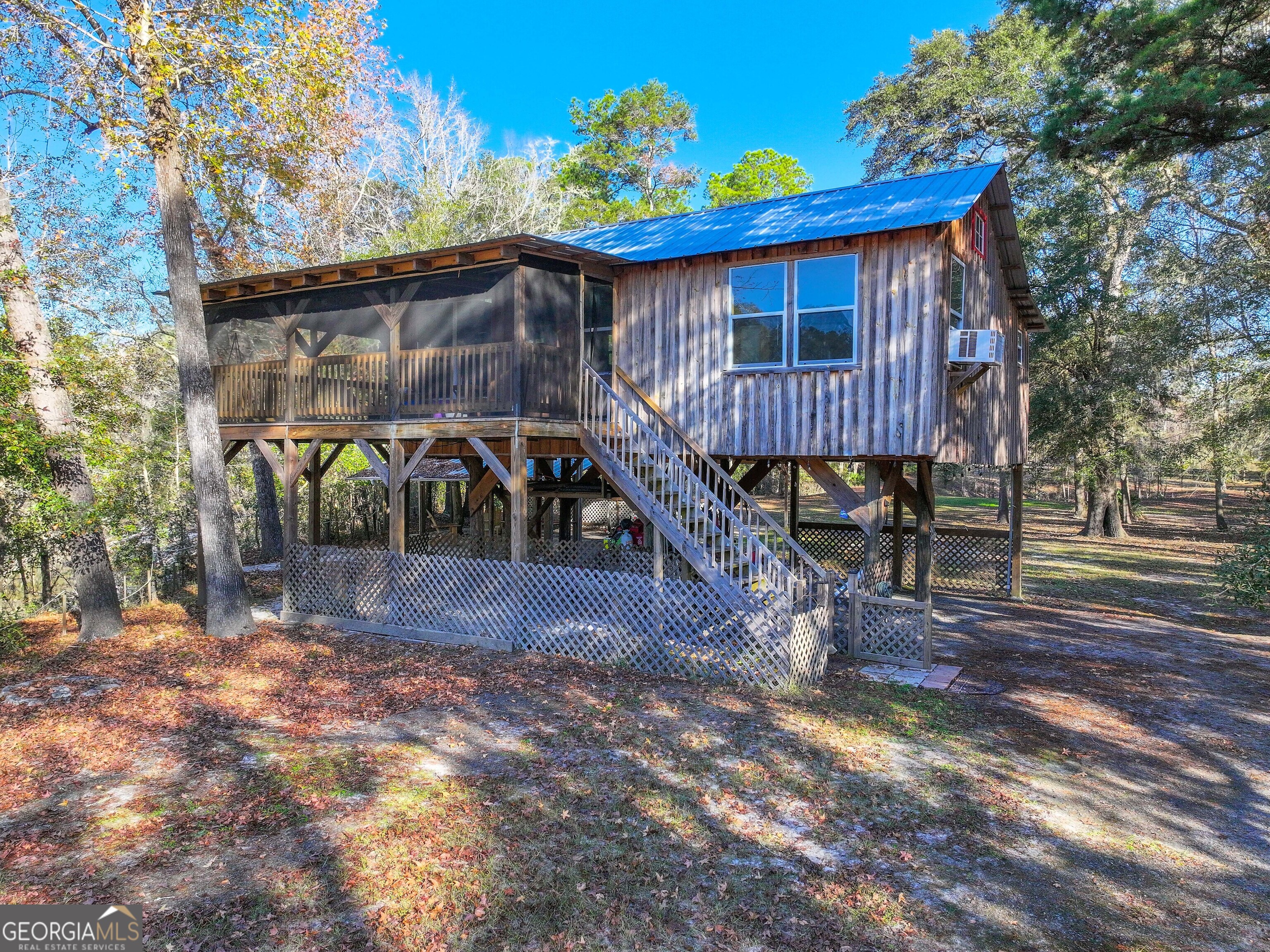 a view of a backyard with a deck and wooden floor