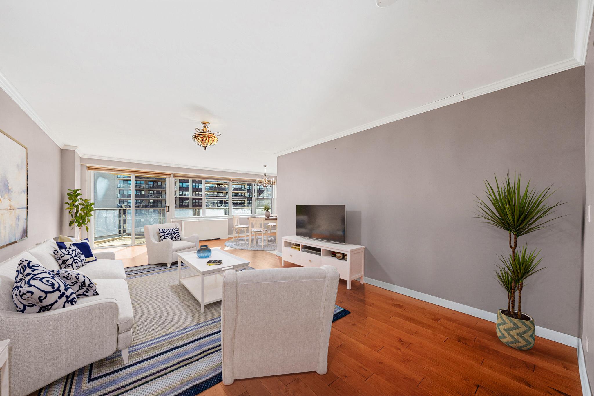 a living room with furniture and a flat screen tv