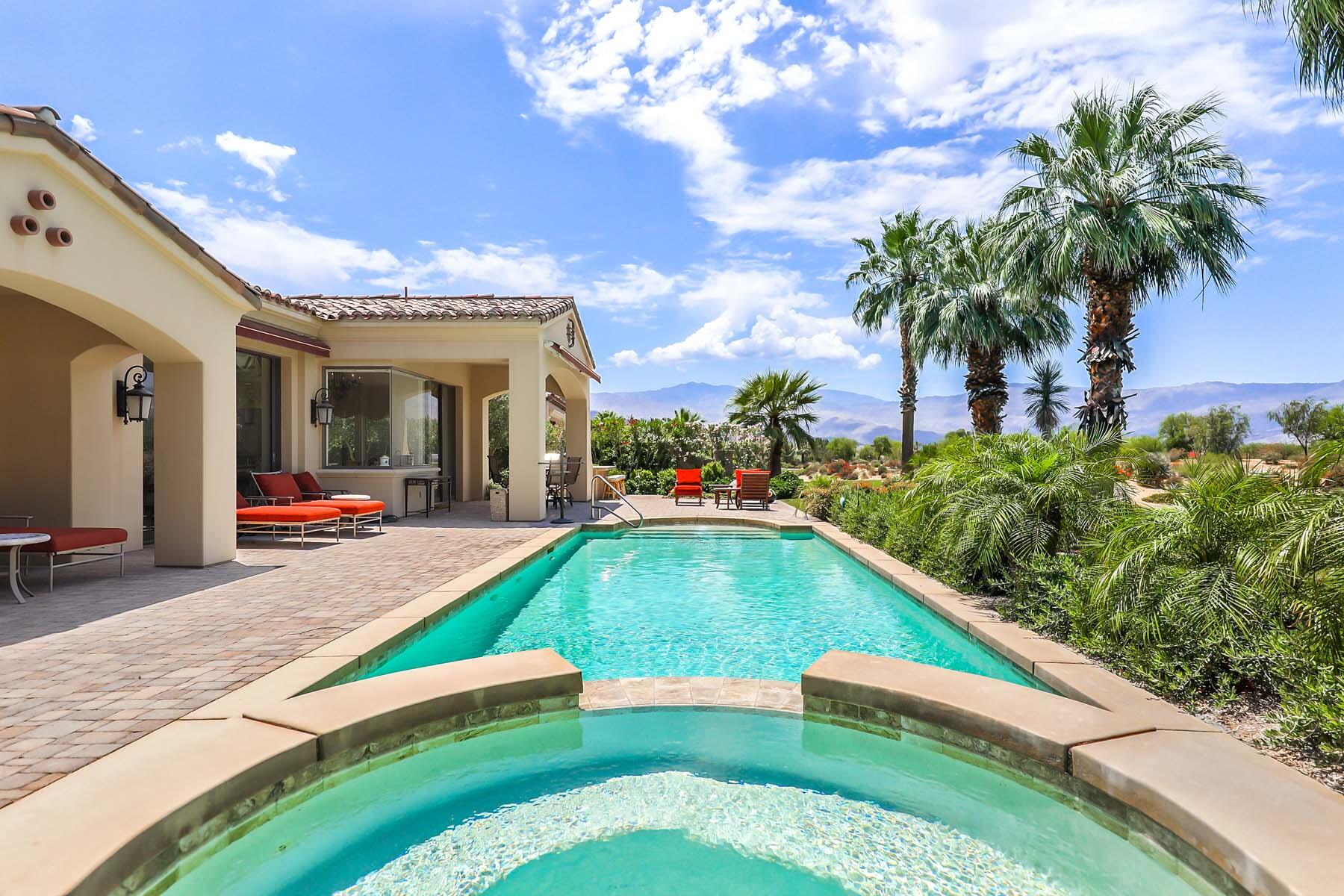 a swimming pool with outdoor seating and yard