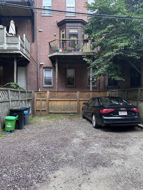 a view of street with parked cars